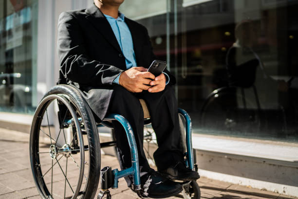 istock Wheelchair man walking on the city 2204564951