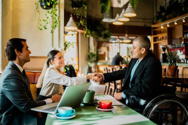 istock Coworkers talking at coffee shop 2204565778
