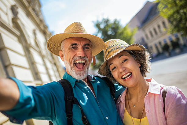 istock Taking selfie in the centre. Elderly married couple exploring new city. 2204567129