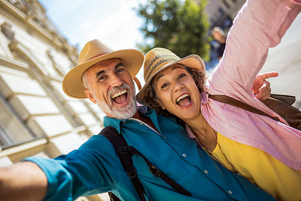 istock Taking selfie in the centre. Elderly married couple exploring new city. 2204567160