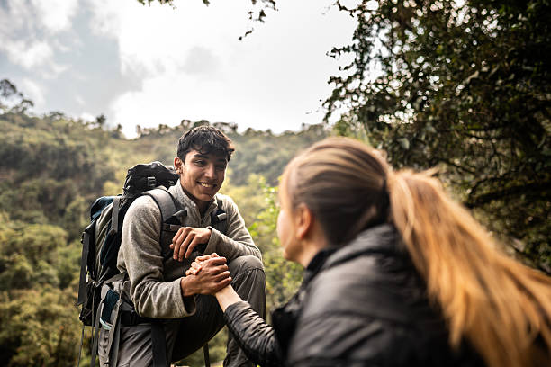 istock Friends holding hands doing trail at nature 2204569851