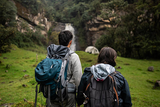 Young couple doing trail at nature