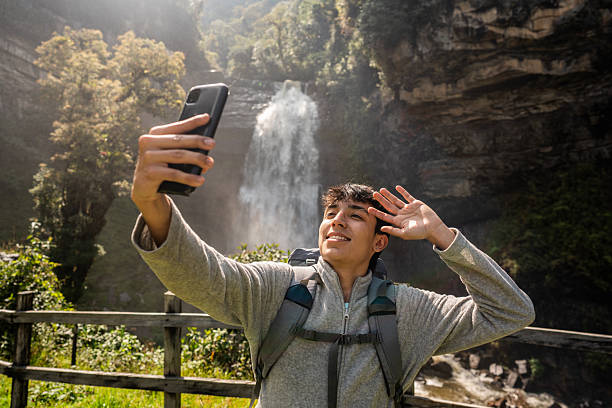 istock Young man taking a selfie at nature 2204569884