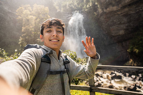 Young man taking a selfie at nature in Junin, Cundinamarca, Colombia - Camera point of view