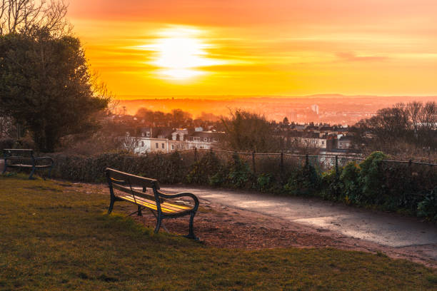 Empty bench overlooking bristol at sunset in brandon hill park