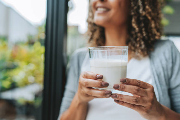 istock Woman drinking milk 2204573026