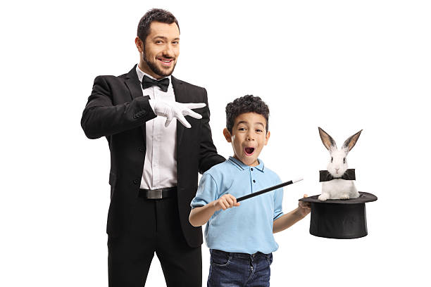 istock Magician and a kid performing a trick with a top hat and rabbit 2204573037