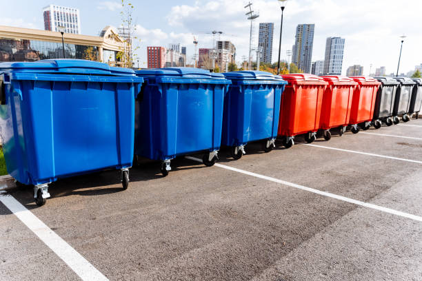 istock In a conveniently designed and spacious parking lot, blue and red trash cans are neatly arranged side by side to ensure easy access for users and efficient waste collection processes 2204573194