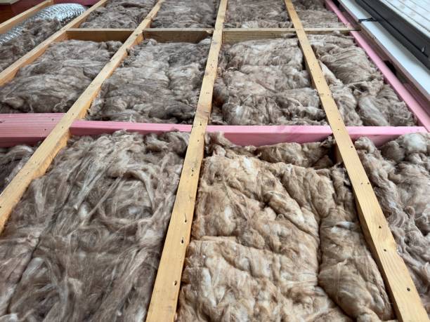 istock Sound proofing thermal efficiency wool being installed in a timber floor 2204576342
