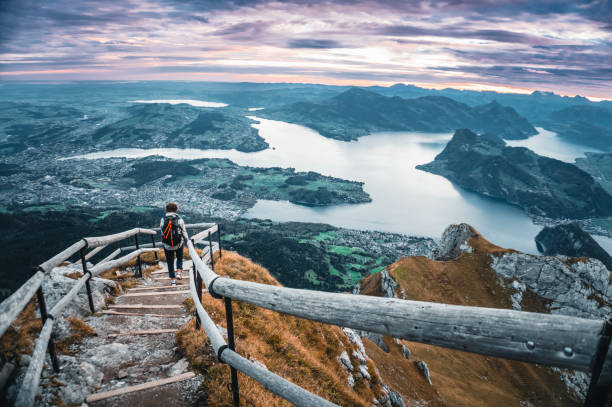 istock Hiker on pathway above lakes and mountains 2204576579