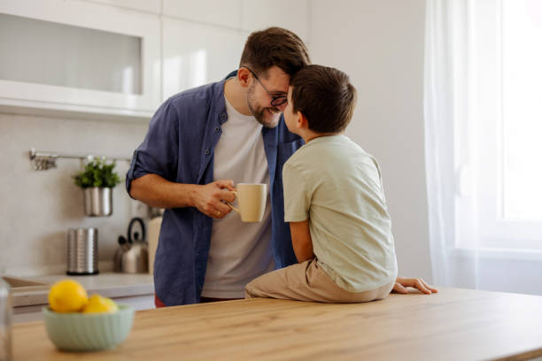 istock Father and Son Enjoying a Happy Morning in the Kitchen 2204576597