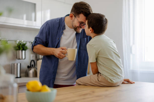istock Happy Family Moment: Father and Son Bonding at Home 2204576912
