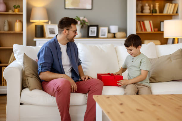 istock Birthday Bliss: Young Father Celebrates with His Excited Little Boy 2204576951