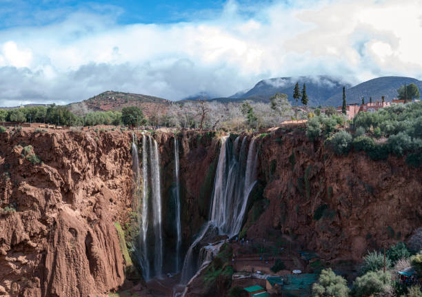 Majestic Ouzoud waterfalls cascade through cliffs in Morocco on a sunny day