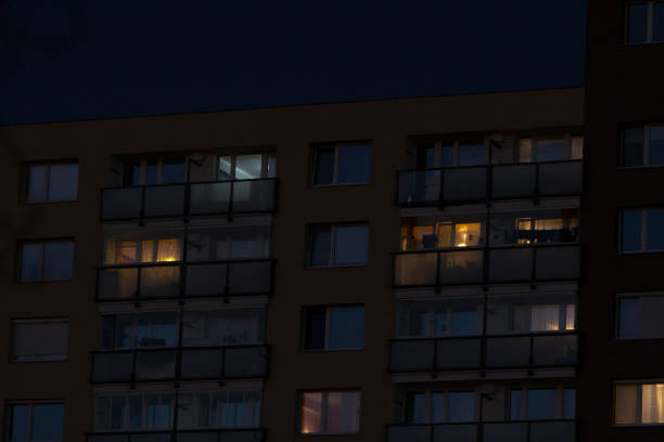 istock A tall building adorned with numerous windows is beautifully lit up at night 2204580951