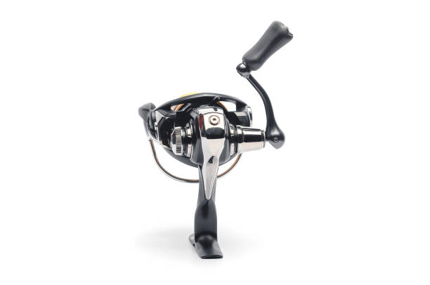 istock Fishing spinning reel with black body on white base 2204583270
