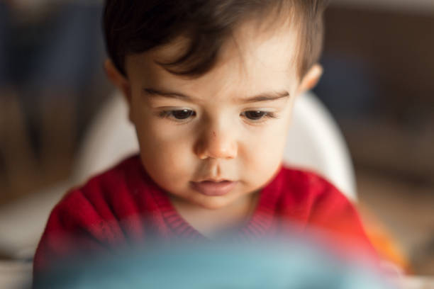 istock Curious Toddler in Red Shirt 2204584065