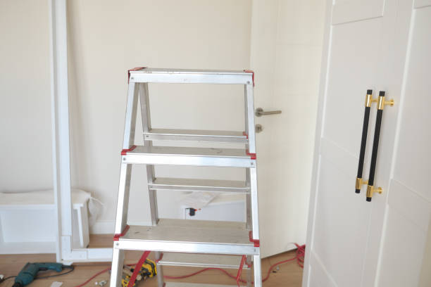 Metal ladder in an empty room