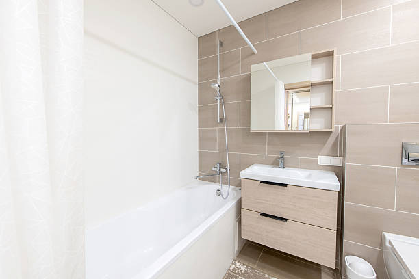 istock Modern Home Bright Bathroom Interior with Bathtub and Stylish Wooden Vanity 2204585609