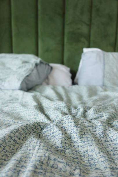 istock messy bed in early morning , messy bed after waking up 2204586368