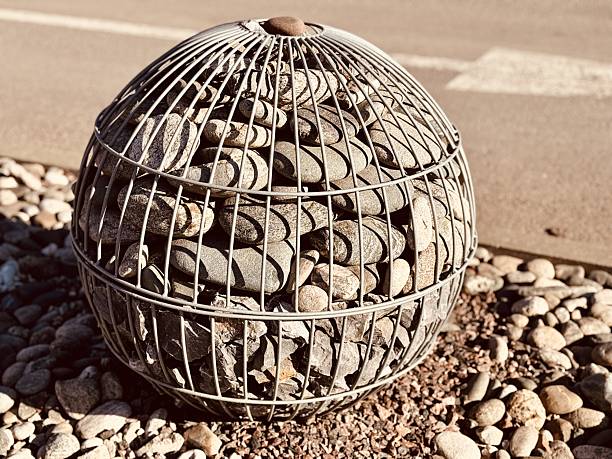 A Visually Striking Artistic Stone Ball and Pebble Display Set in an Urban Environment