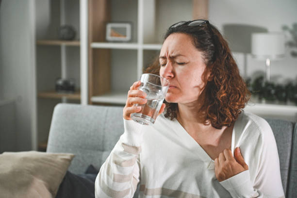 istock woman suffering from heatstroke at home 2204587569