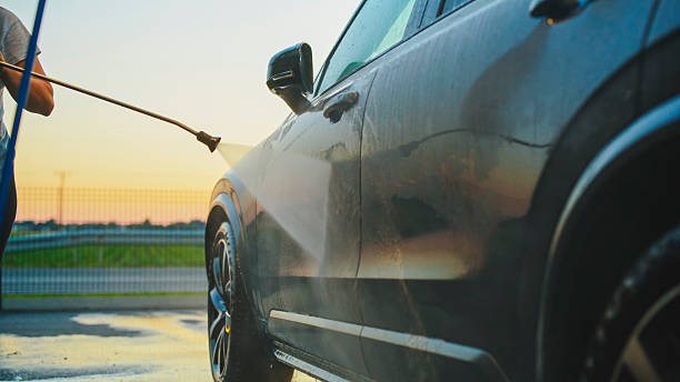 istock Evening Car Wash with High-Pressure Hose at Blue Hour 2204587862