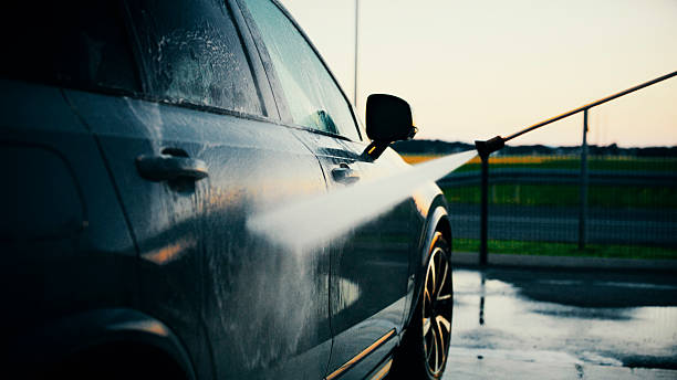 istock Evening Car Wash with High-Pressure Water Spray at Blue Hour 2204587882