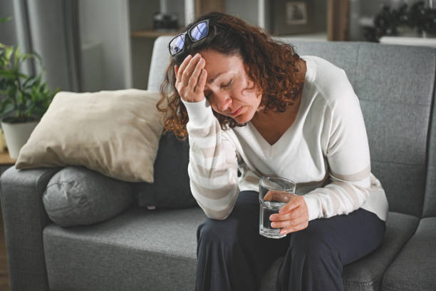 woman suffering from heatstroke at home woman suffering from heatstroke at home Hormonal Imbalance stock pictures, royalty-free photos & images