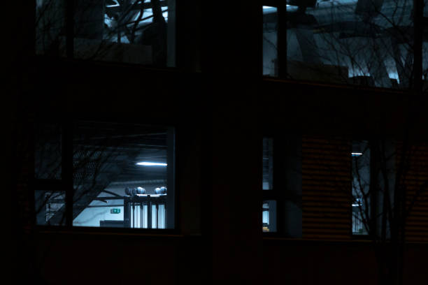 istock In a dark room that is filled with numerous windows and lights illuminating it 2204590016
