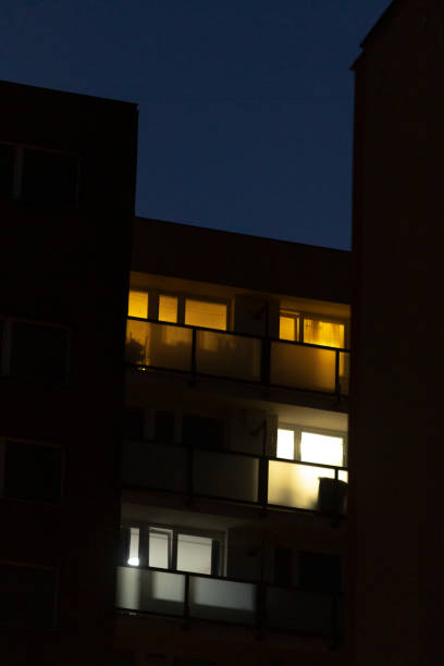 istock At night, a building filled with numerous windows is brightly lit up 2204590618
