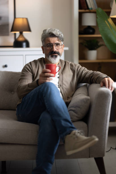 istock Thoughtful man enjoying a relaxing coffee 2204590804