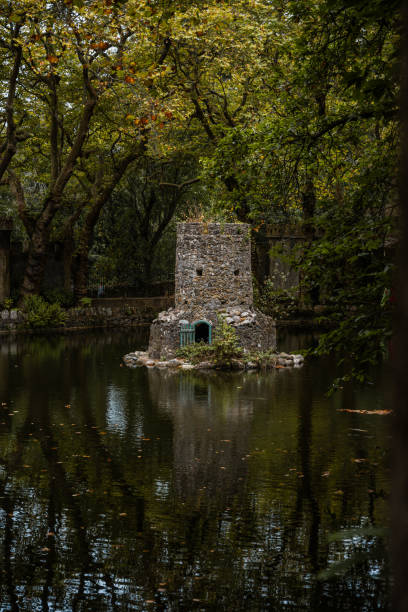 A tower in the middle of the water in the National Park of Pena in Sintra, Portugal.