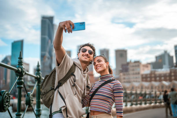 istock Young Hispanic Couple Taking Selfie Outdoors in Sydney 2204591472