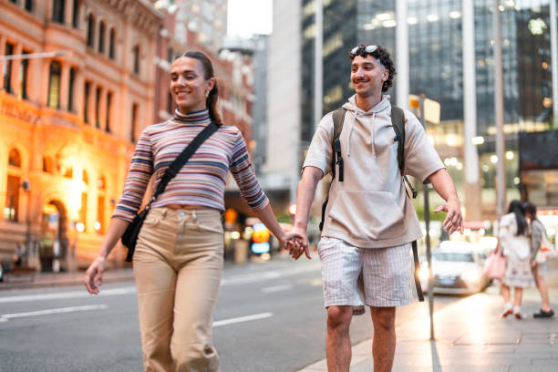 istock Young Hispanic Couple Exploring Sydney Streets at Dusk 2204591555