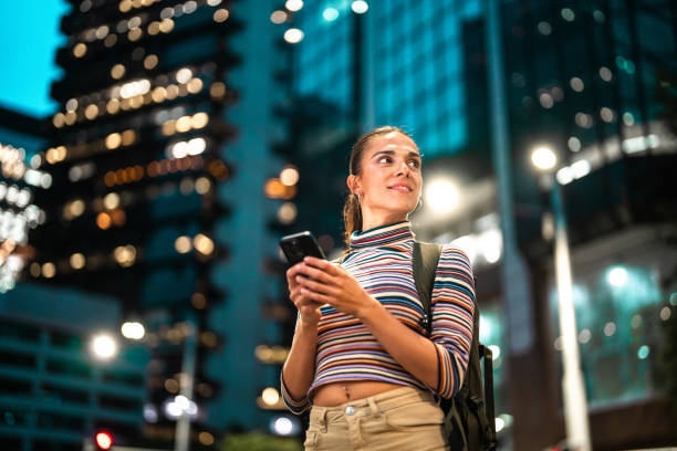 istock Curious Young Hispanic Man Exploring Sydney Streets at Night 2204591625