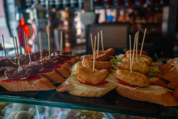istock Tapas (pintxos, sandwich) with small  chicken cutlet and slice of tomatoe, and   pie from egg or cheese: 2204594483
