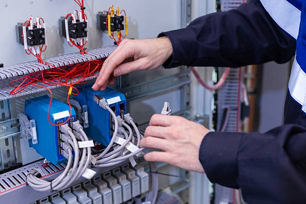 istock assembly of electrical cabinet components, installation of components in production, hands on site main plan 2204596304