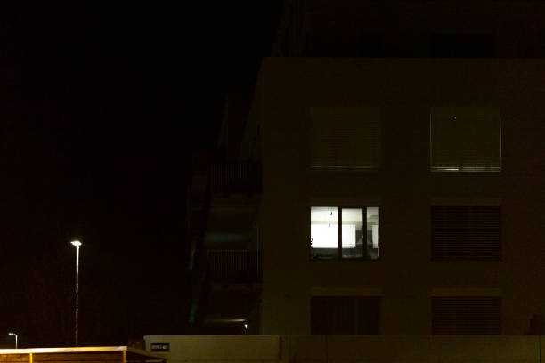 istock A large building with many windows is beautifully lit at night 2204597877