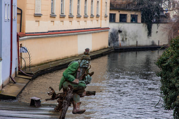 A cityscape view of the city of Prague across the Vltava river.
