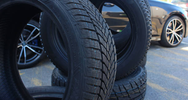 istock Car is visible through the new tires staying on the edge 2204602934