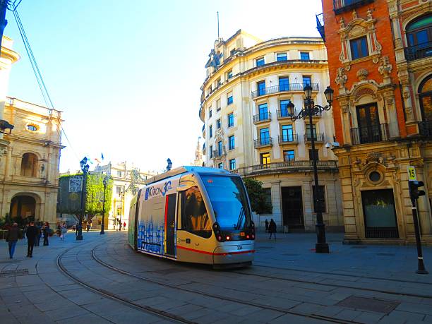 Seville, Spain - November 1, 2016: MetroCentro tram on Avenida de la Constitucion. These trams are able to run without overhead wire