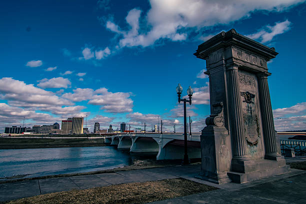 Photograph of a monument in Sunrise Metro Park of Dayton, OH overlooking the Miami River and the skyline.