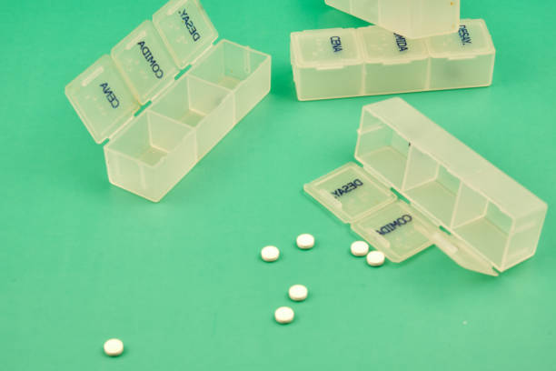 istock Pill organizers labeled in Spanish help manage daily medication, ensuring timely doses during the day. 2204605197