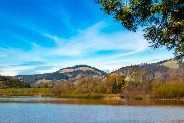 Spring Lake Regional Park, a public park in Santa Rosa, California, in Sonoma County wine country. Beautiful rolling hills and sunny skies in the afternoon reflected in the lake.