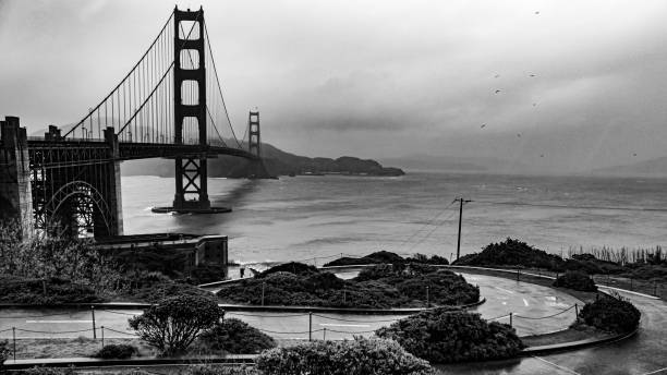 Dramatic view of the Golden Gate Bridge in San Francisco, California, on a cloudy stormy day