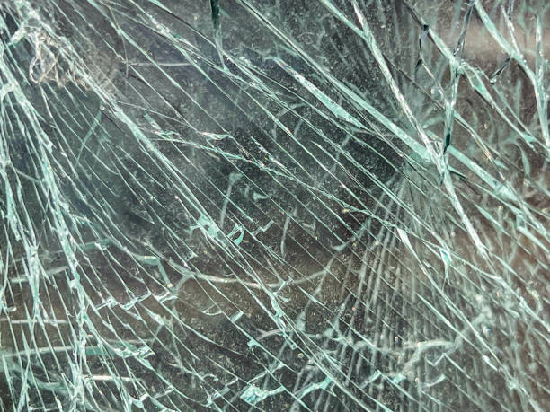 istock A broken car window that hasn't fallen apart yet, as a background 2204610323