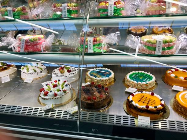 istock Assortment of Decorative Cakes in a Bakery Display 2204615365
