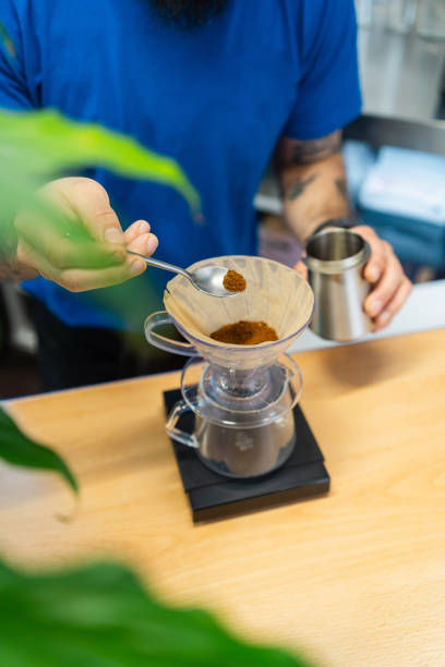 Specialty coffee preparation, weighing ground beans for precise pour over brewing method