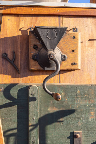 istock Antique coffee grinder on an old chuck wagon. 2204615757